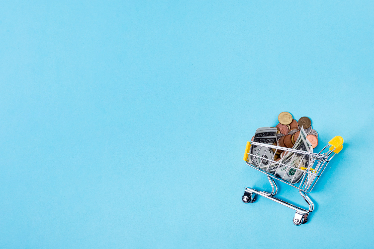 Shopping cart filled with coins